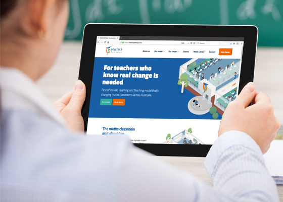 Hands holding ipad showing Maths Pathway custom website design